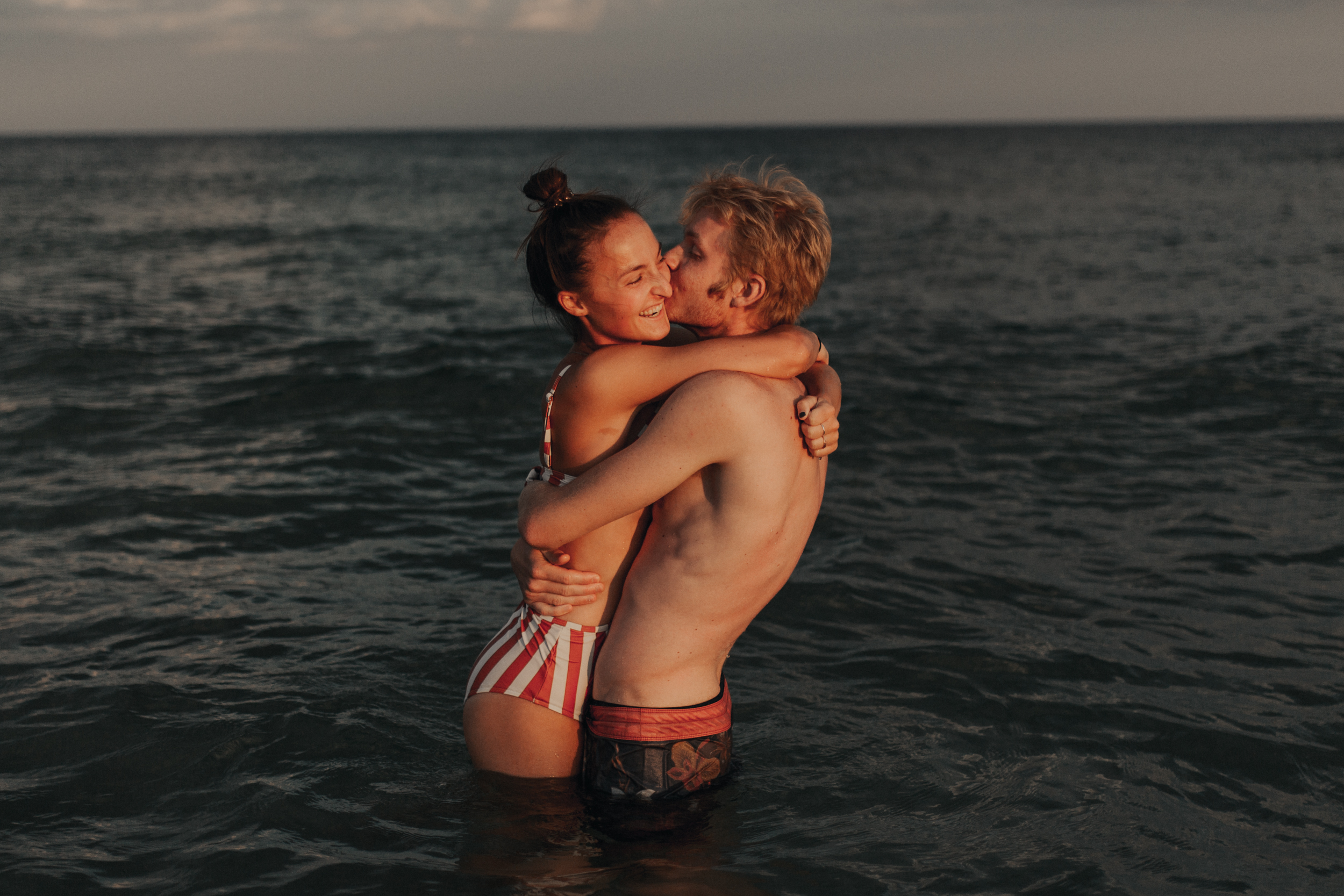 young couple in love in ocean
