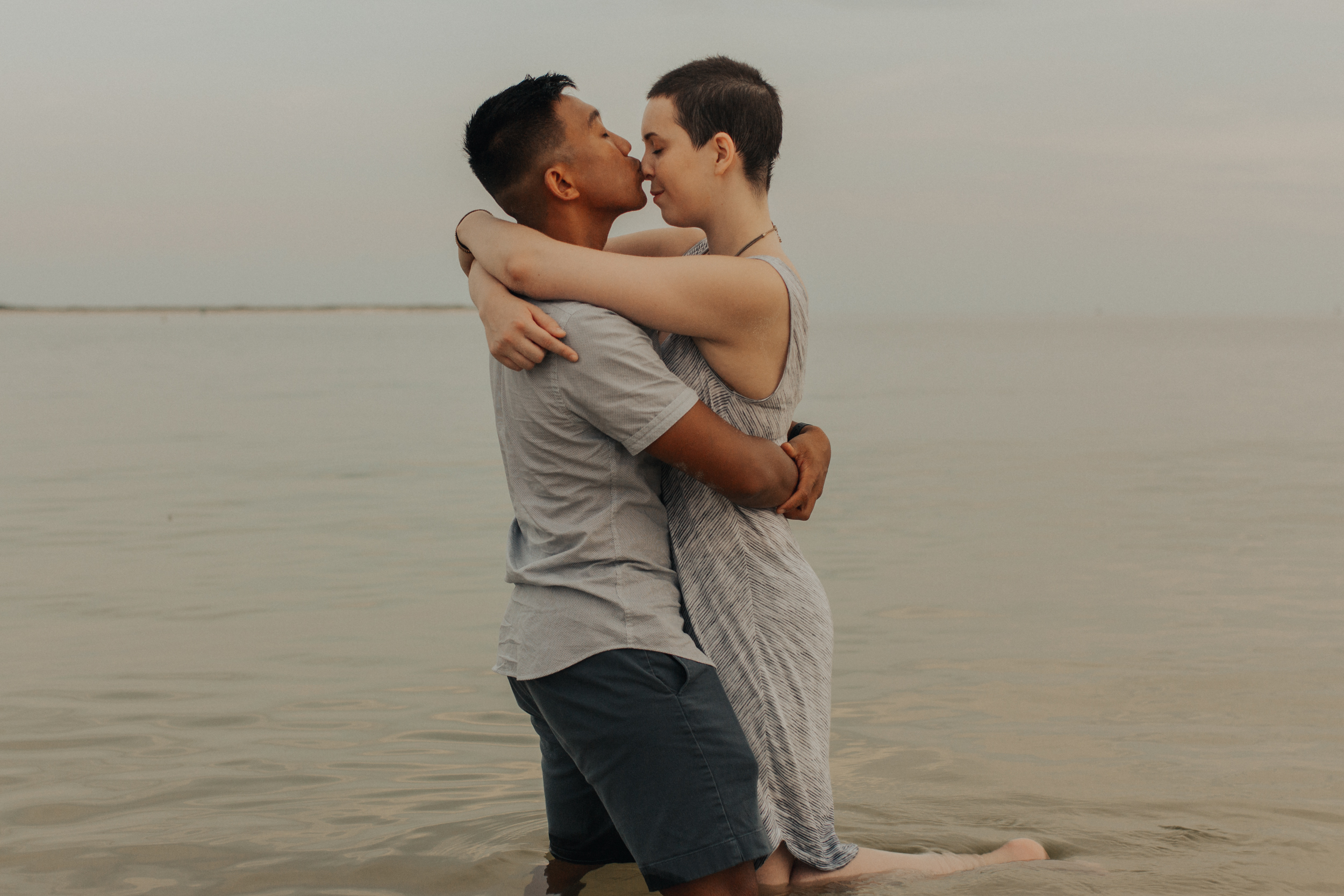 couple embracing in ocean