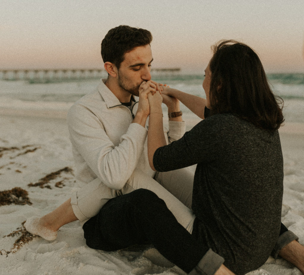 Kissing Hands on Beach